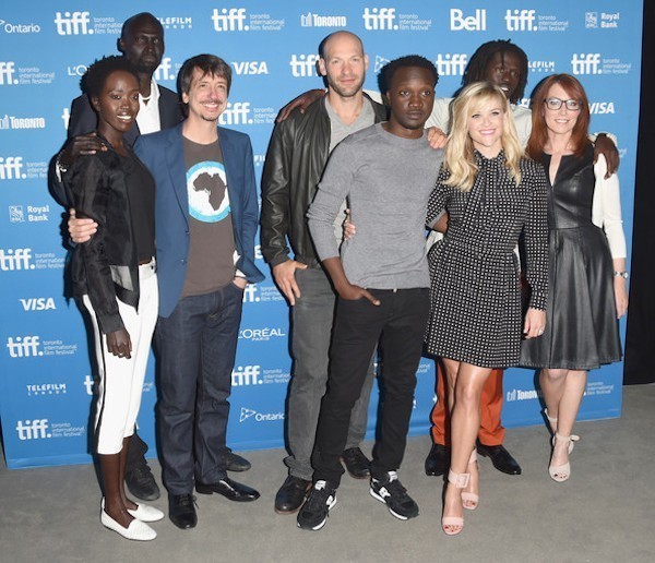 L-R) Actress Kuoth Wiel, actor Ger Duany, director Philippe Falardeau, actor Corey Stoll, actor Arnold Oceng, actress Reese Witherspoon, actor Emmanuel Jal and screenwriter Margaret Nagle pose at 