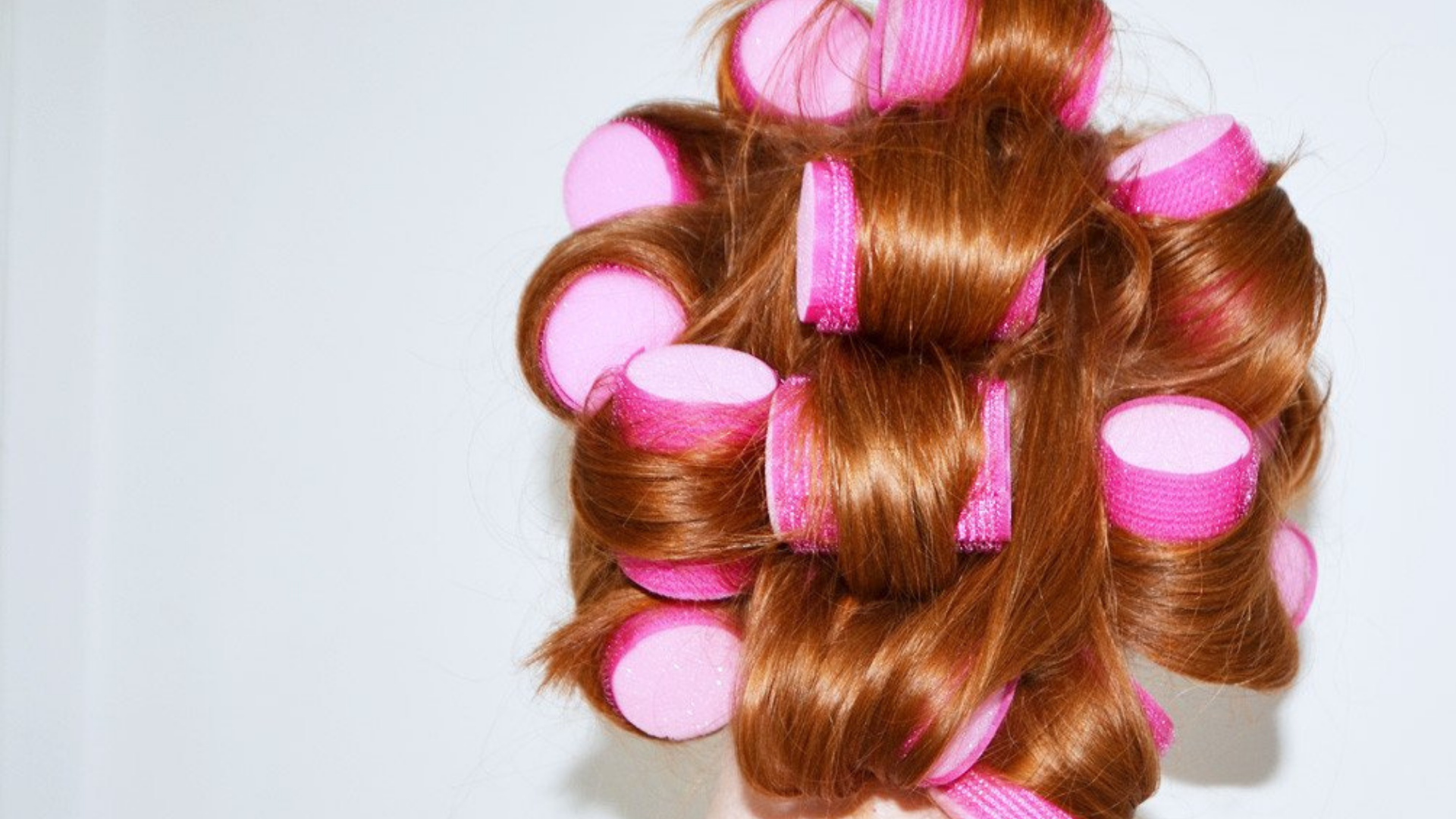 How to Use Velcro Rollers Without Damaging Your Red Tresses